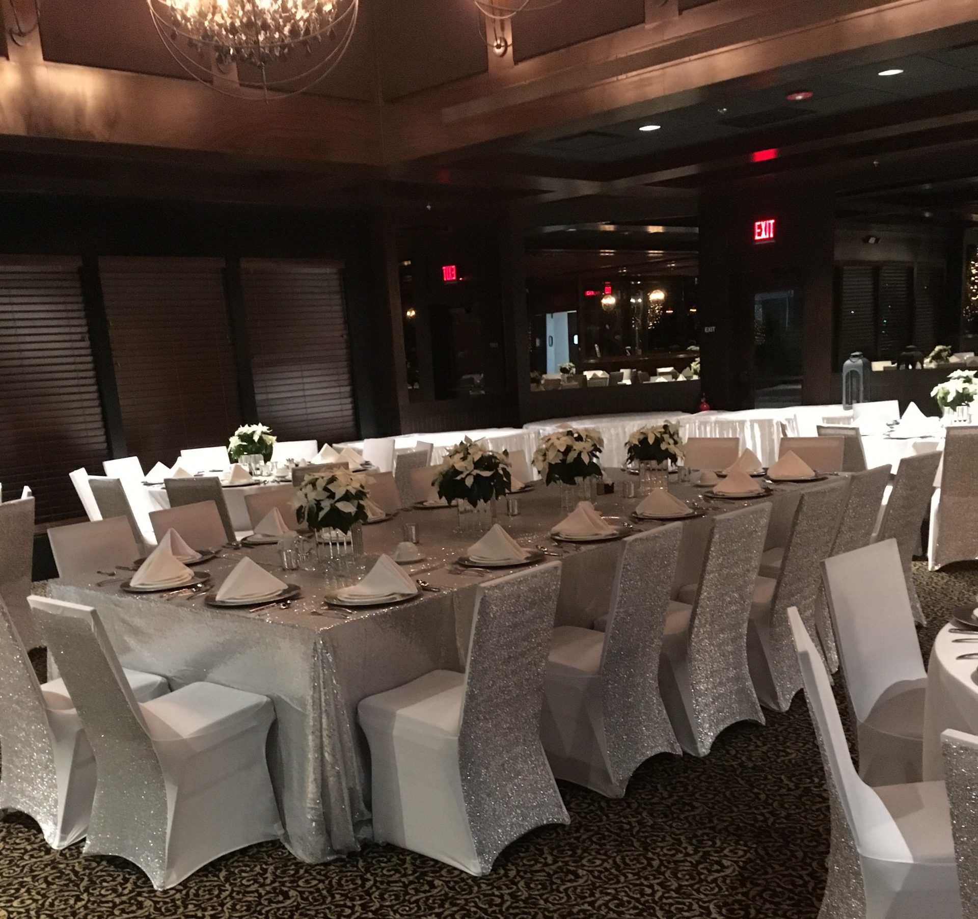 Head table dressed in silver sequin linens