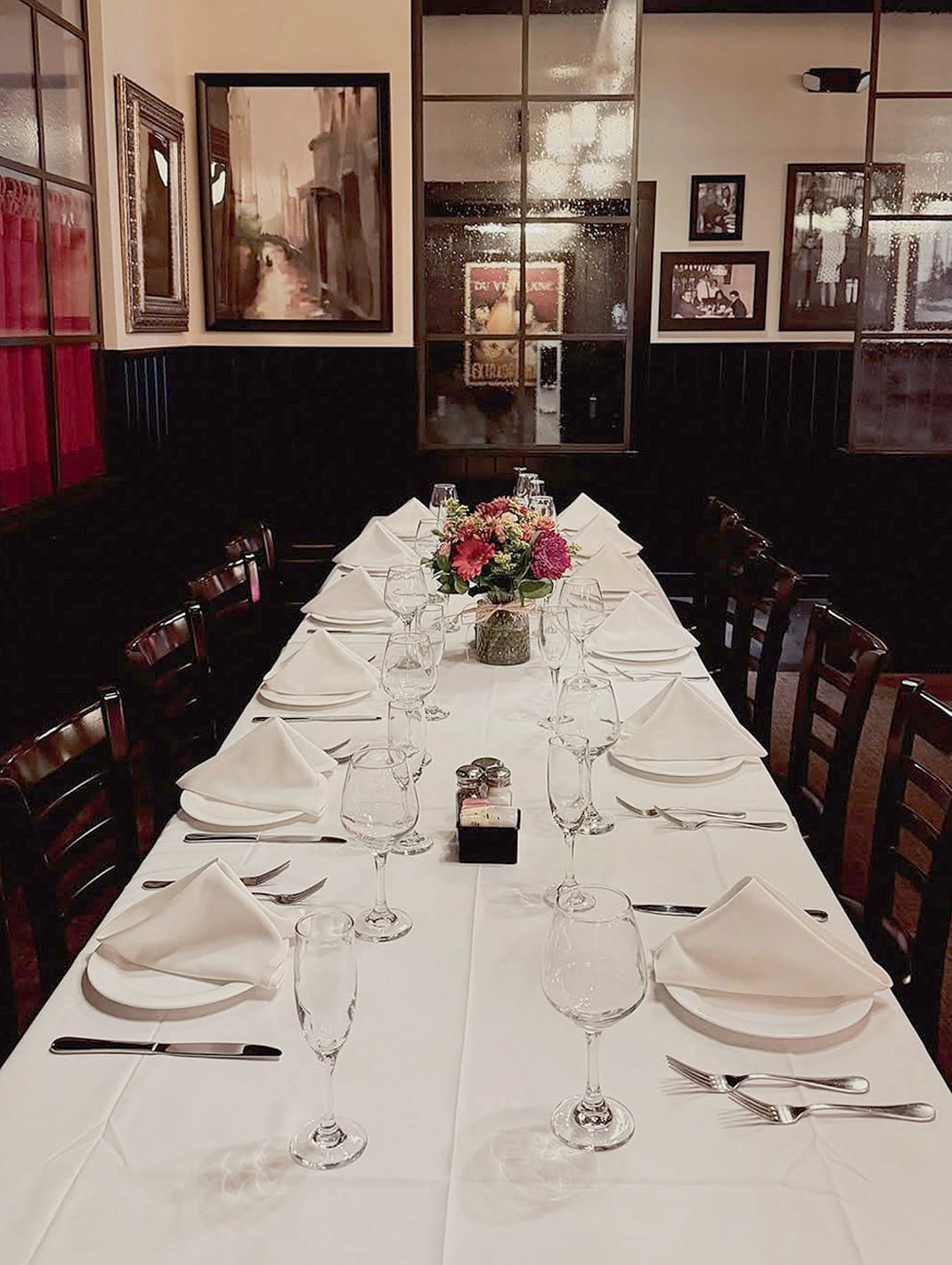 A long table set for a gathering in the dining room