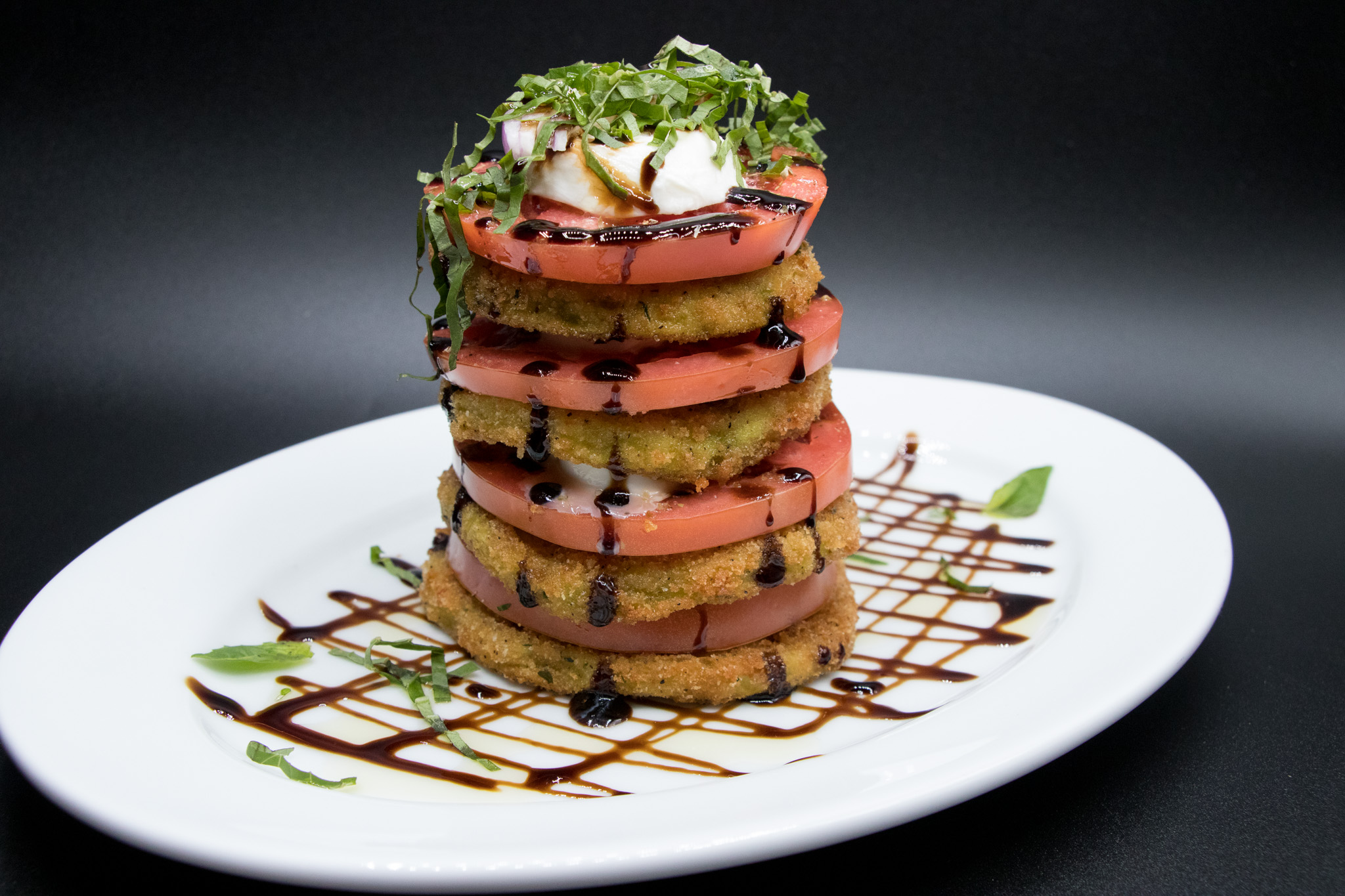 Fried green tomato caprese stack with mozzarella and balsamic